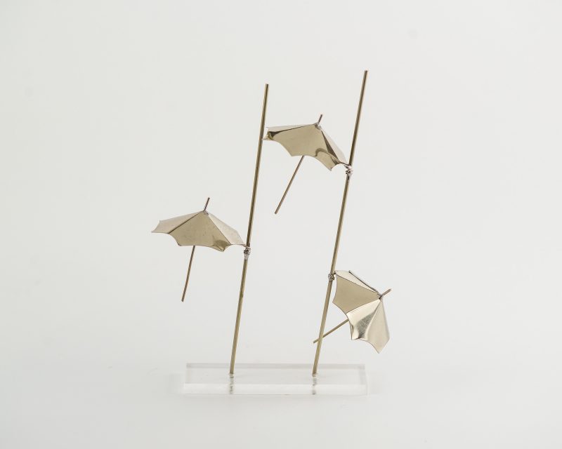 3 Umbrellas on Plexiglass Stand of Brass or Alpaca. One of Thessaloniki's Symbols.